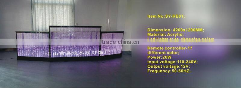 fatastic hotel frond desk receiption with led lights and water bubble moving.