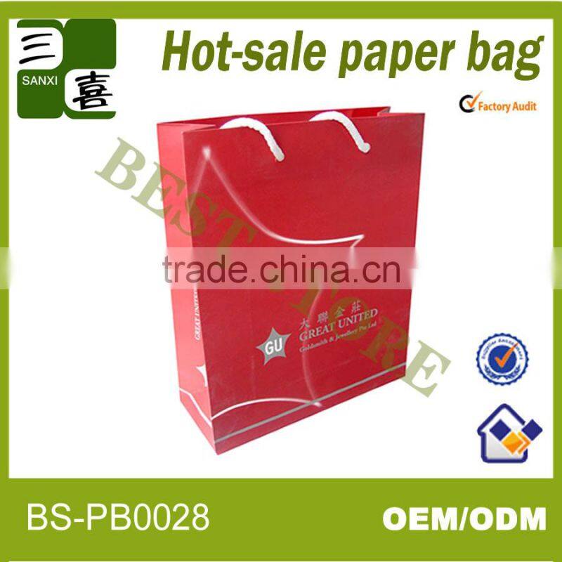 red printed paper gift carry bag with ribbon