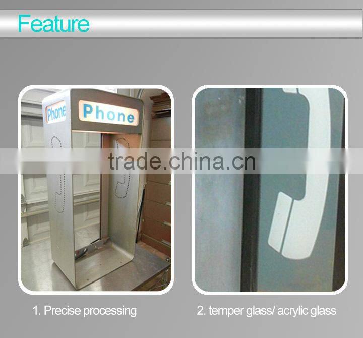 Blue antique telphone booth with telephone sign