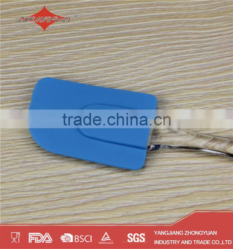 blue silicone spatula with plastic handle