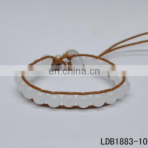 Handmade beaded wrap bracelet features 3 rows of circular and square stones surrounded by a natural colored cord on both sides