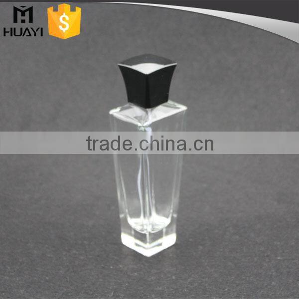 empty perfume bottle glass with black cap