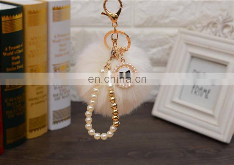 2021 Wholesale custom luxury fur ball key holder Pearl keychains pom pom bow keychain for women bag good quality