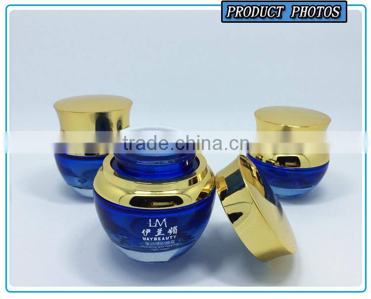 Bule colored glass cosmetic serum bottle and glass cosmetic cream jar with gold pump lid