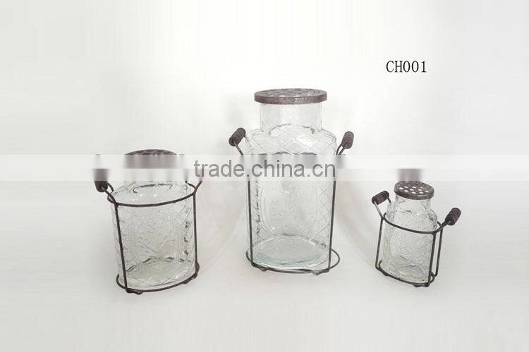 cut flower in different glass container with metal stand