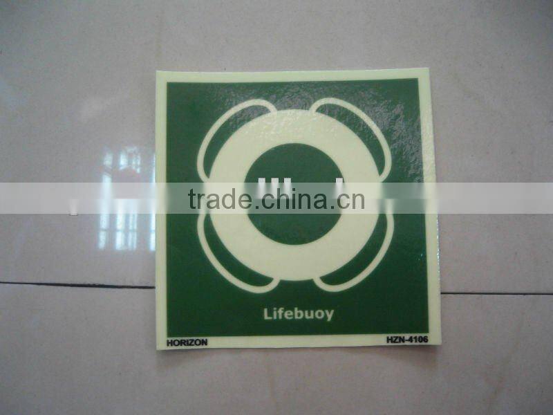 Photoluminescent film for safety sign