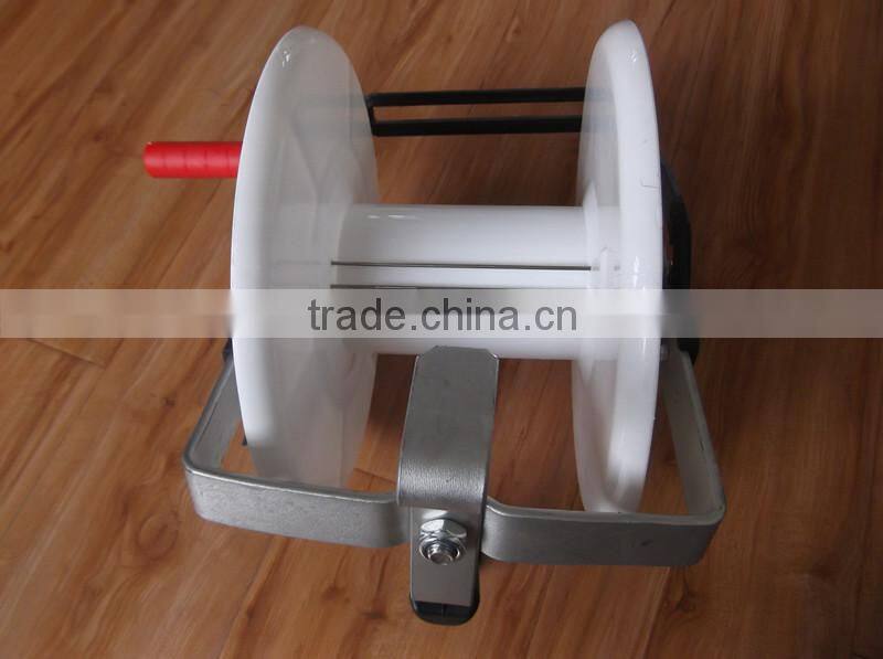 fence reel with livestock fence energizer