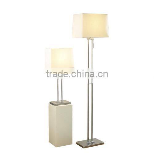 Floor Lamp with Antique brass finish with a cream fabric shade