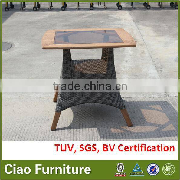 Teak wood with insert black glass top, rattan base outdoor table