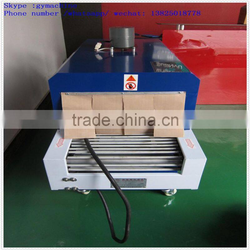 Automatic over wrapping heat shrinking machine