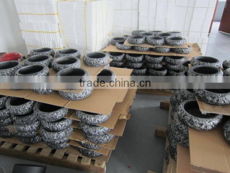 grey fiber stone fireplace with cylinder borosilicate glass