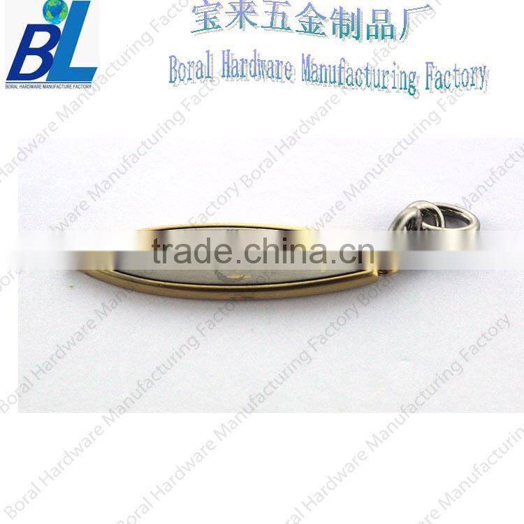 Two-tone engraved zipper slider for leather jackets