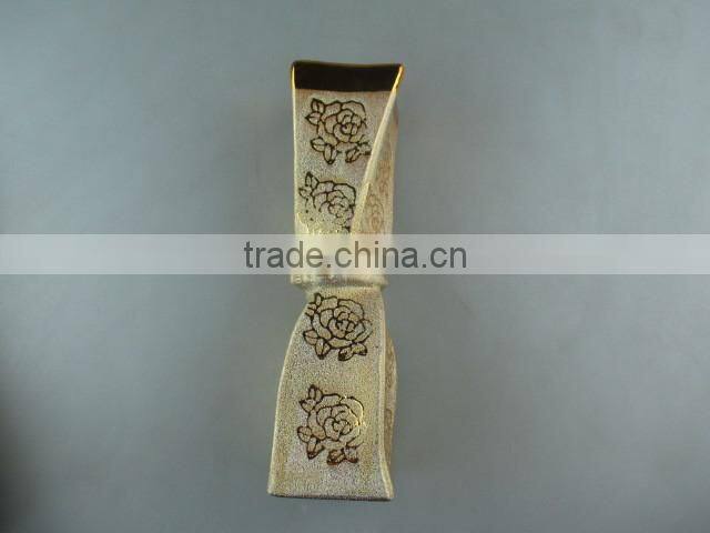 beautiul golden porcelain type vase with flower design