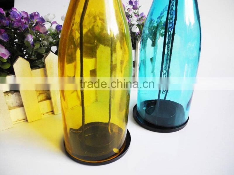 Scented candle in colored glass jar hanging bottle