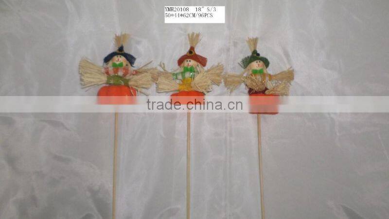 Straw and fabric scarecrow with pumpkin for Halloween decoration