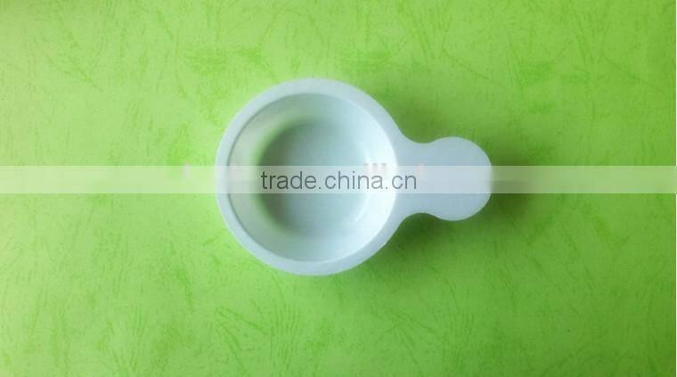 white disposable plastic tray for urine testing.