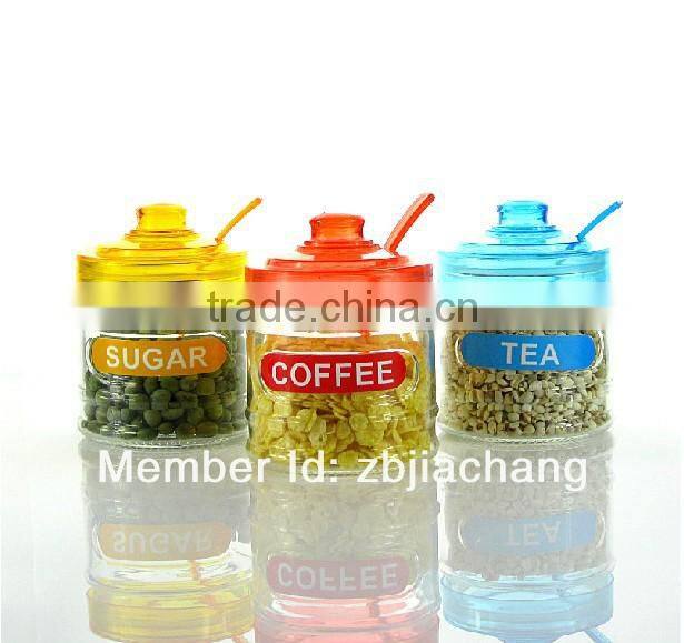 glass spice box with plastic cap and spoon