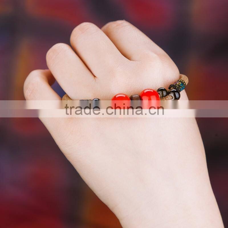 Retro Chinese Red Handmade leather Ceramic bead bracelet with bell on it