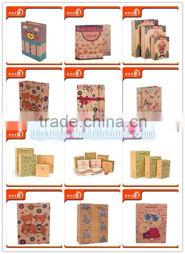 2016 XHFJ popular garment shopping paper bag design in craft paper