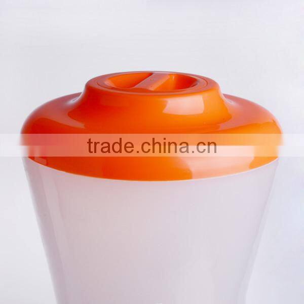 orange plastic juice dispenser with fire hydrant