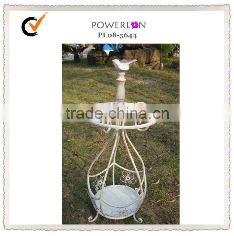 Antique metal basket beach umbrella holder