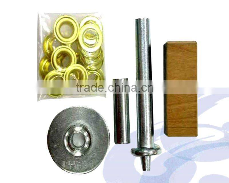 eyelet punch tools kit with wooden plank