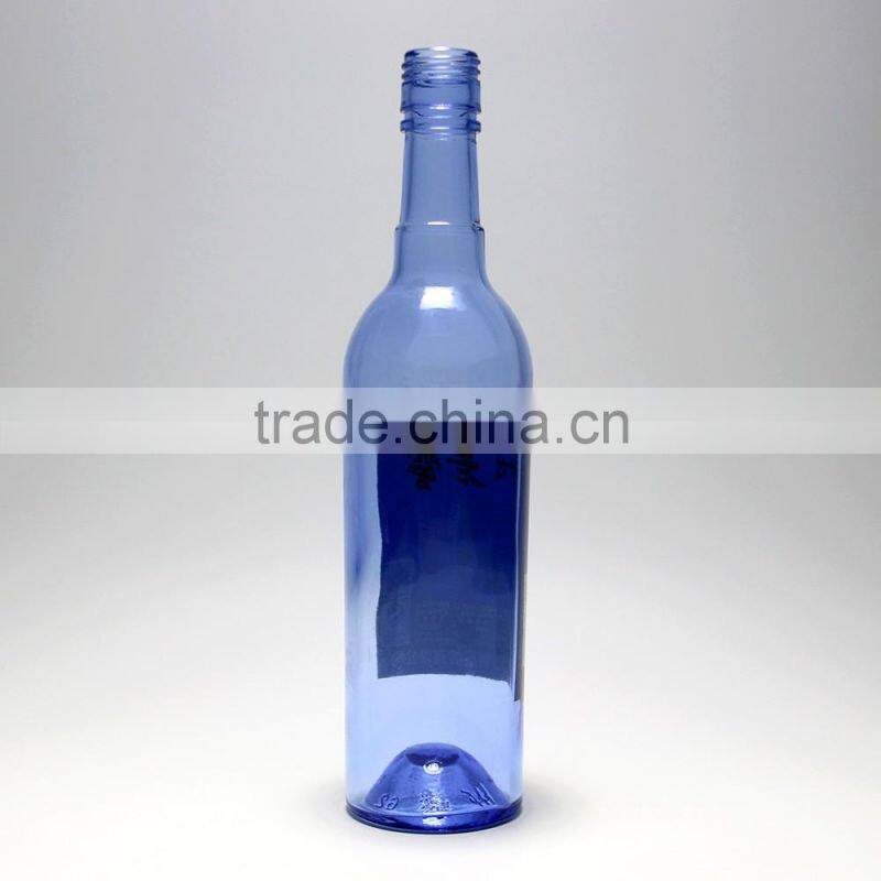 Blue clear glass wine bottle witn long neck beer bottle