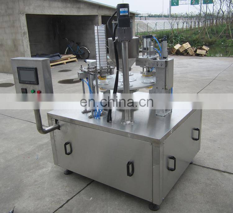Rotary plastic cup filler and sealer machine