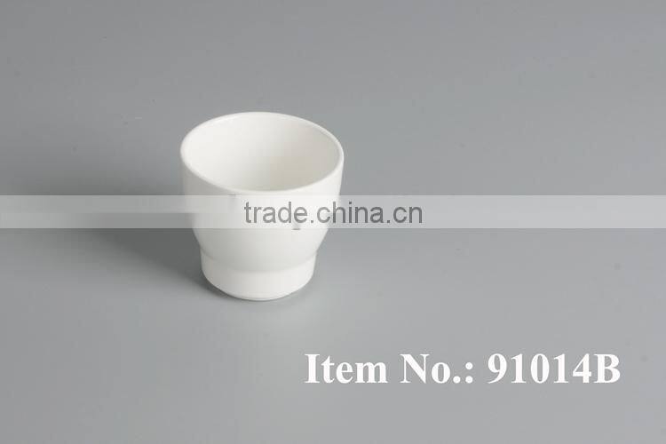 white porcelain tea cup