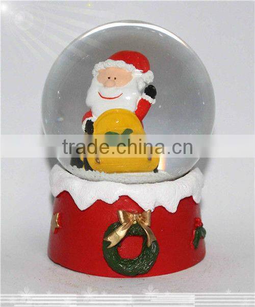 Resin santa snow globe with blowing snow
