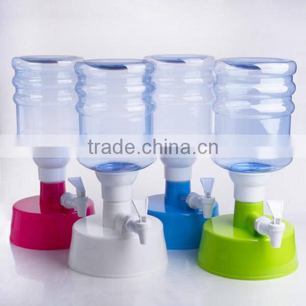 colorful plastic juice dispenser with blue stand and fire hydrant