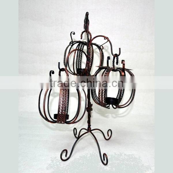 Three pumpkin shape candle holders with stand
