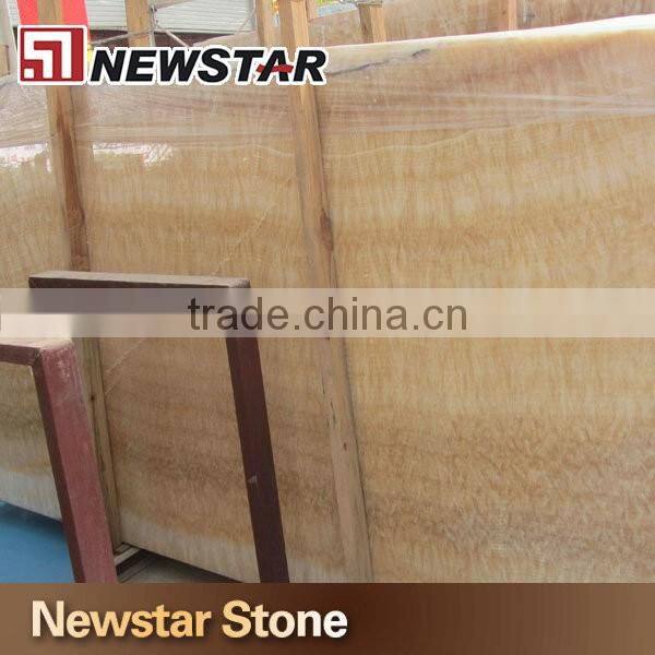 Backlit transparent honey yellow onyx marble tiles