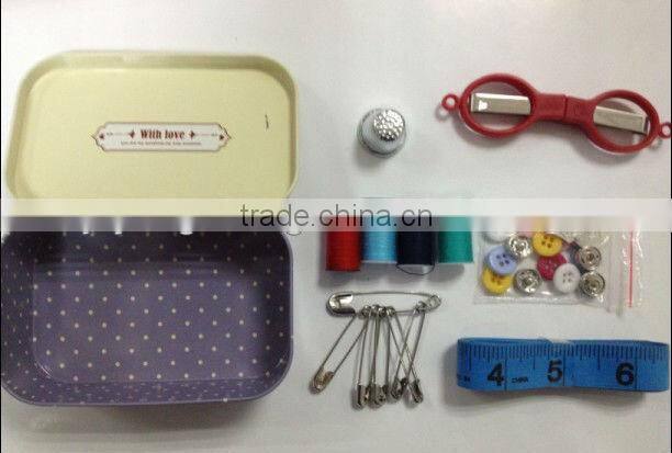 retro sewing kit in tin