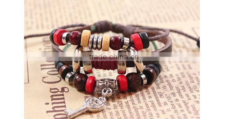 >>best selling multi layered key Charms bracelet, braided leather bracelet /