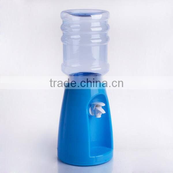 colorful plastic juice dispenser with blue stand and fire hydrant