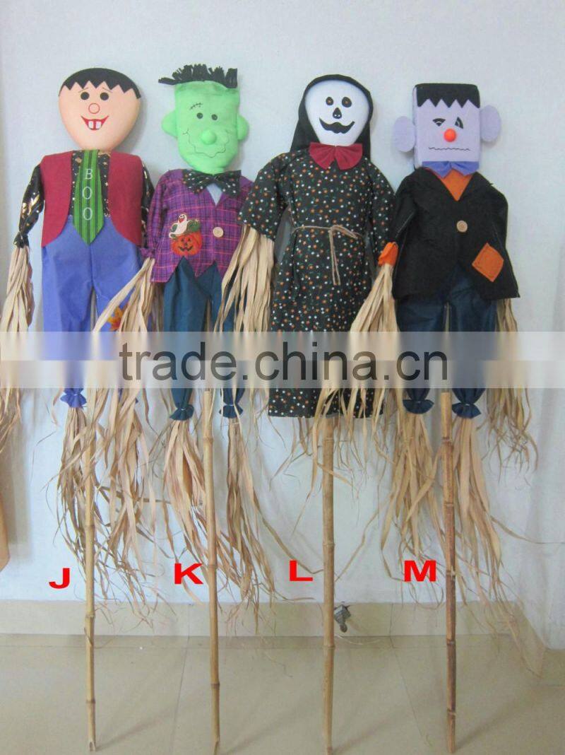 Paper straw and fabric scarecrow for autumn and harvest decoration