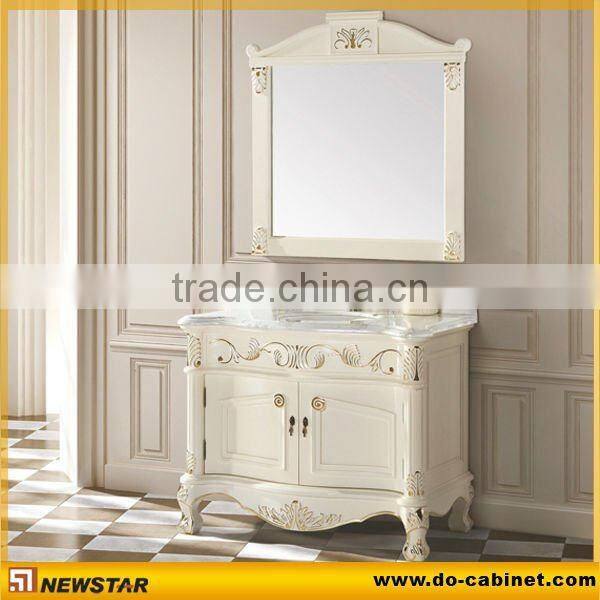 bathroom vanity cabinet with marble countertop and ceramic basin