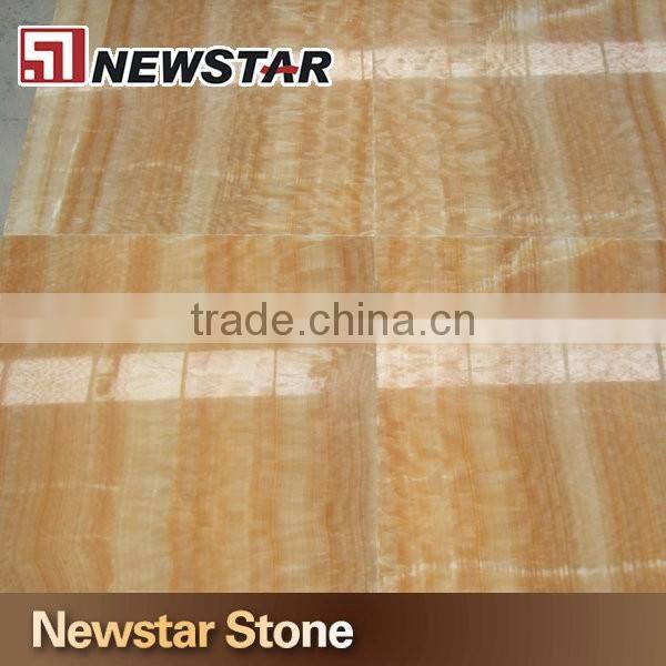 Backlit transparent honey yellow onyx marble tiles