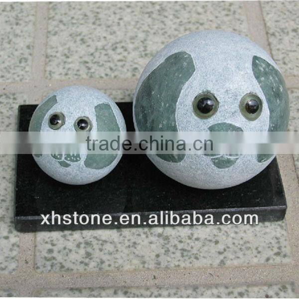 Various colors of egg shape stone dog statue