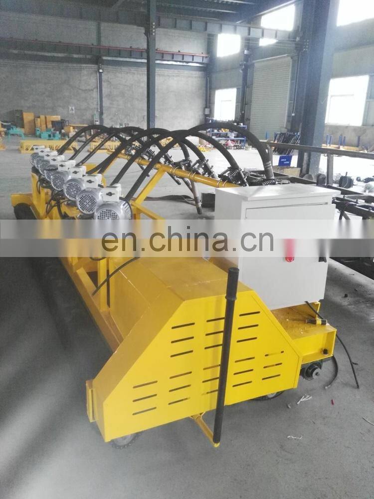 concrete road paver machine showing the first auger blade roller laying machine