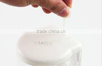 Clear plastic box of commercial liquid hand soap dispenser