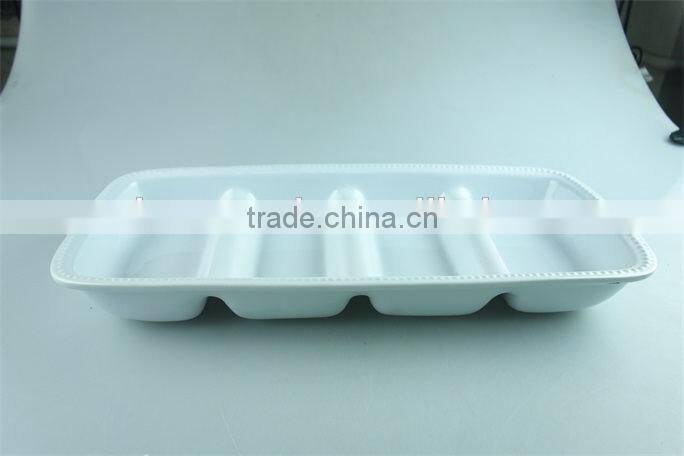 stocked white ceramic rectangle French fries serving plate with dipping dish and iron stand