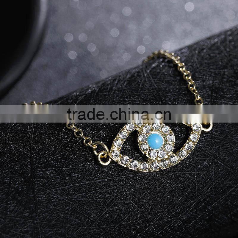 rhinestone evil eye charm gold chain bracelet