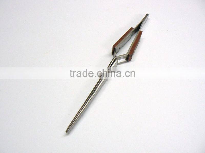 TWEEZERS CROSS LOCKING