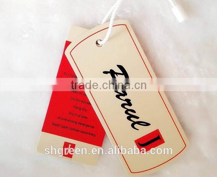Center fold paper hangtag with plastic string tags for jeans denim