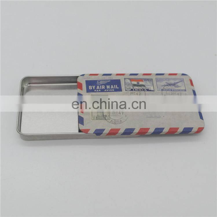 Flat sliding tin candy packaging case with embossing
