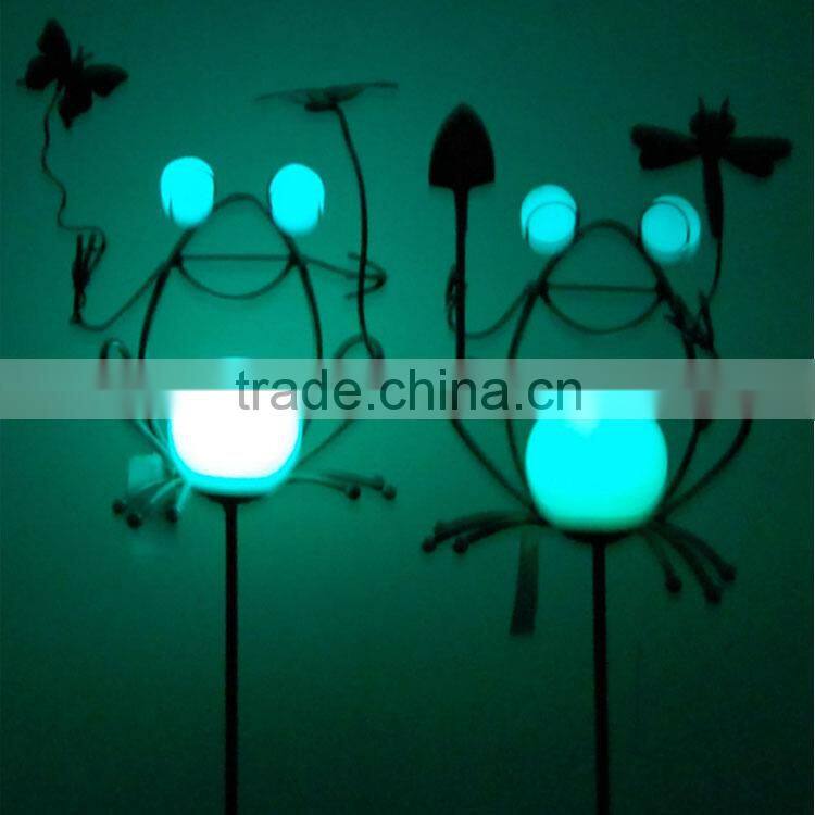 glow in the dark butterfly in flower garden decoration
