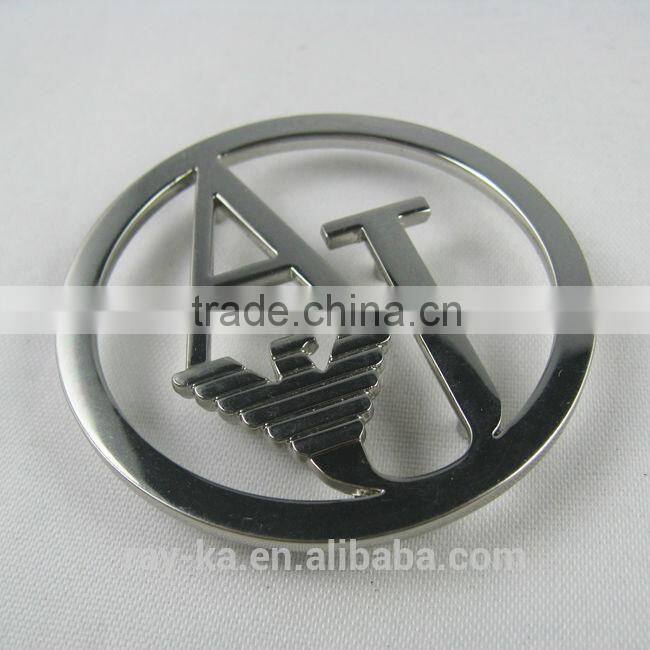 designer metal emblems handbag