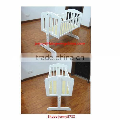 white wooden baby cradle bed